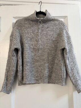 Cozy knit sweater—perfect to snuggle up in this fall